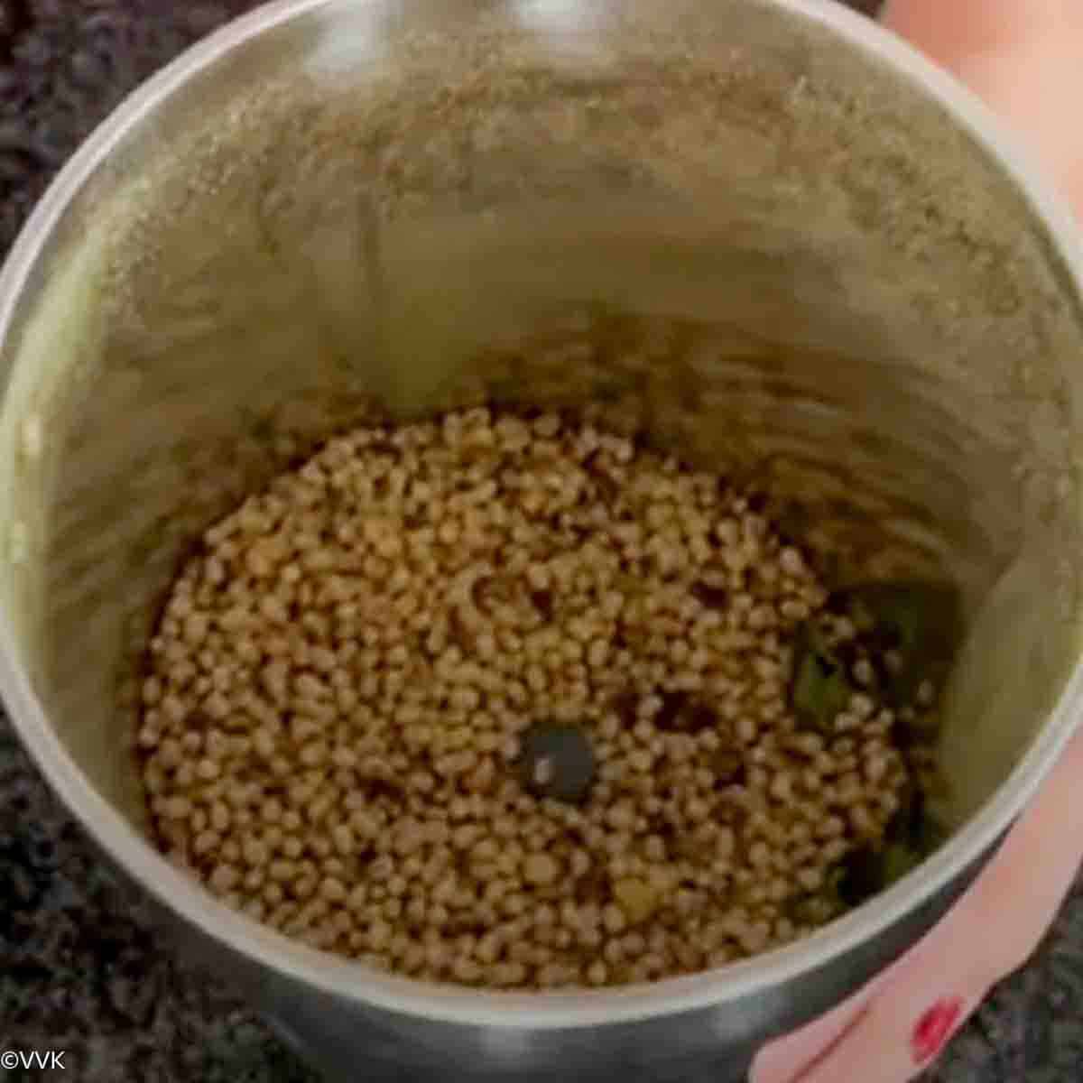 adding lentils and grinding