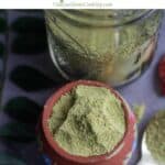 curry leaves powder with text overlay for pinterest