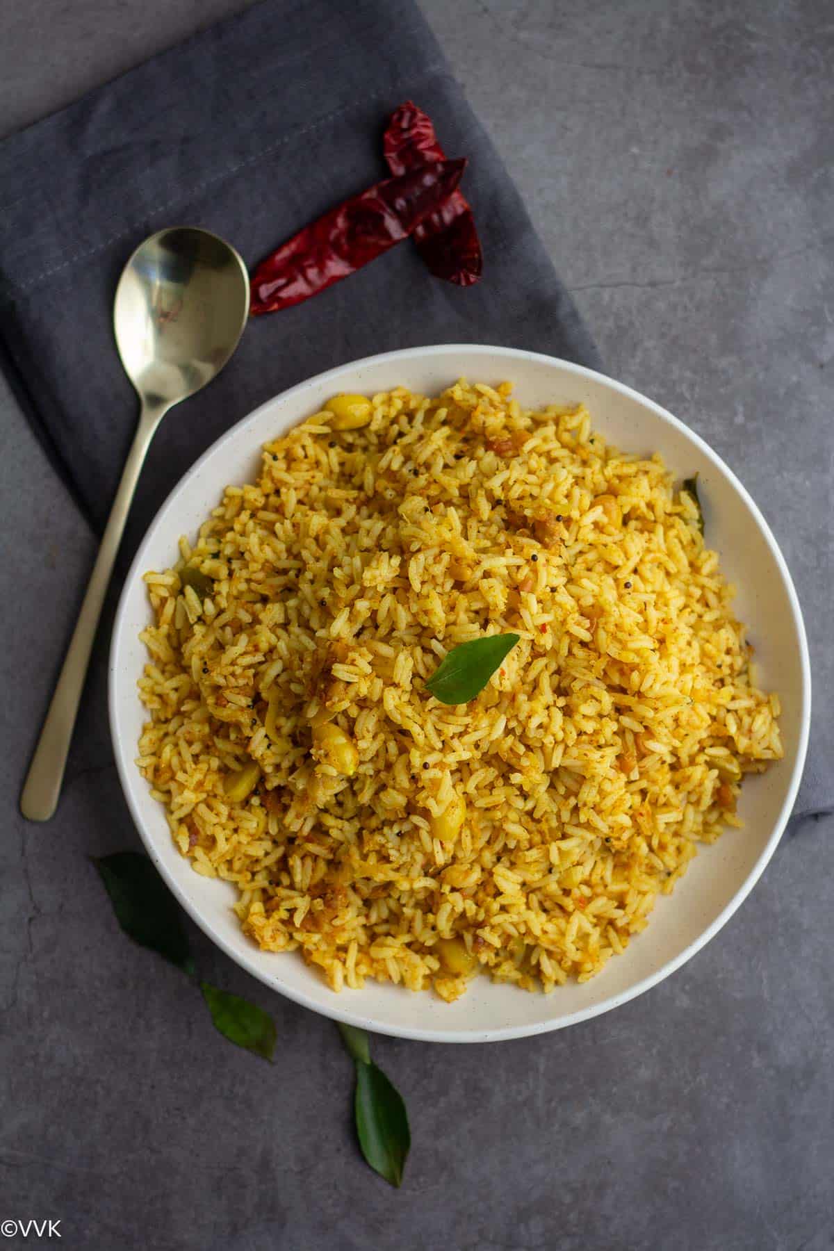 overhead shot of raw mango rice served in white plate