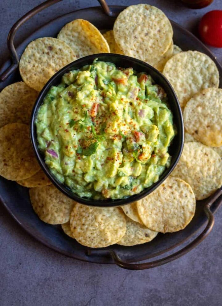 overhead shot of guacamole served with chips