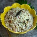 square image of thalicha sadam served in a yellow bowl