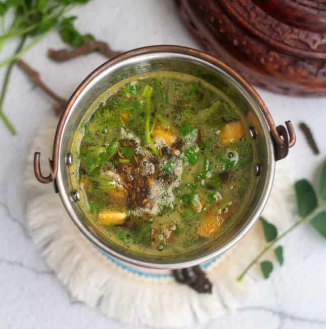 square image of thippili rasam served in small bucket