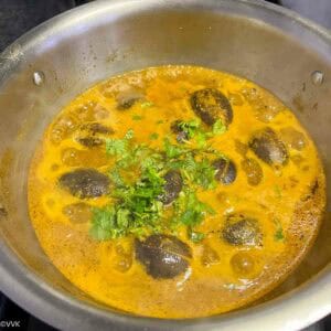 adding the cilantro for the kuzhambu