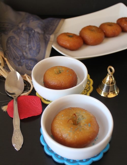Badusha or Balushahi looking extra yummy and served in three different bowls, decorated with festival specials