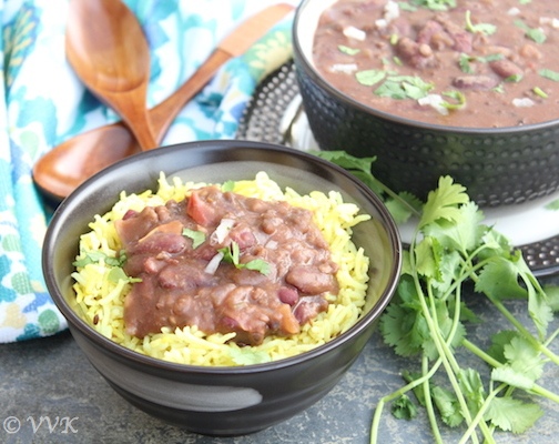 Slow Cooker Vegan Dal Makhani served on top of a bowl with yellow rice and cilantro on the side
