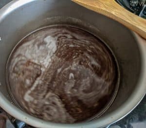 Jaggery water left simmering for a couple of minutes