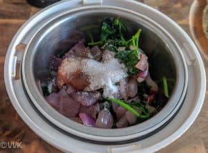 Grinding the onion, parsley, salt and tamarind paste