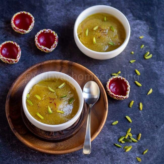 square image of badam halwa served in white bowls