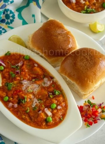 square image of pav bhaji served on white plate