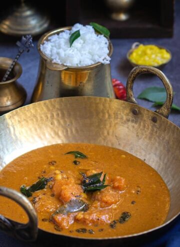 square image of pumpkin sambar served in kadai