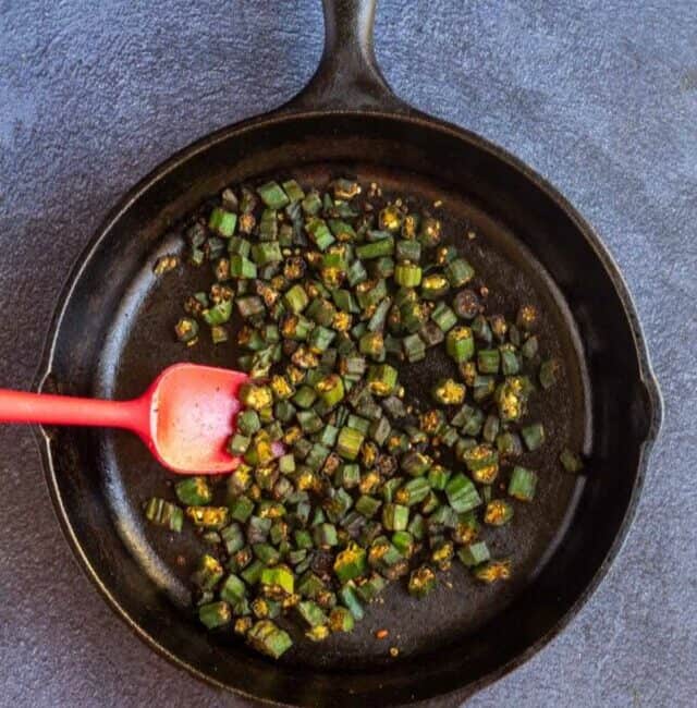 overhead shot of okra fry served directly from the cast iron pan