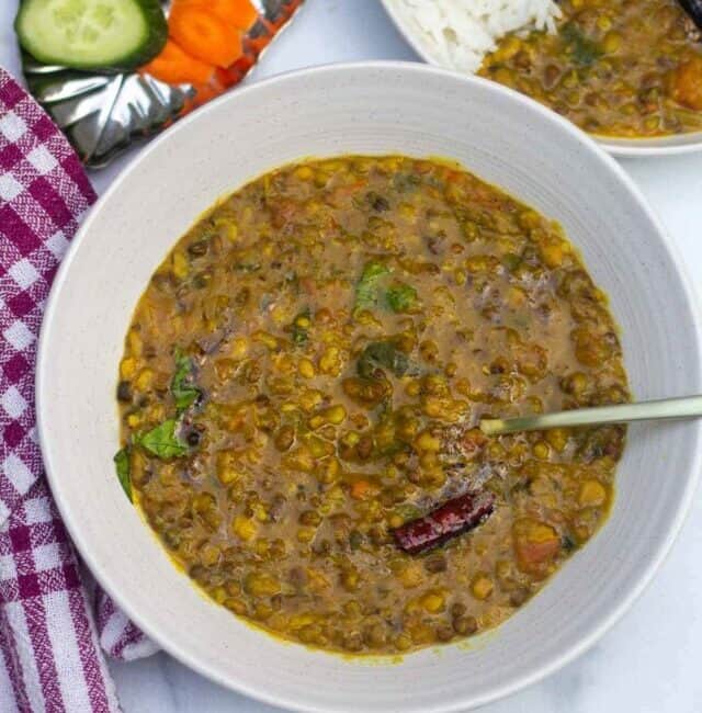 panchmel dal served with raw veggies and rice