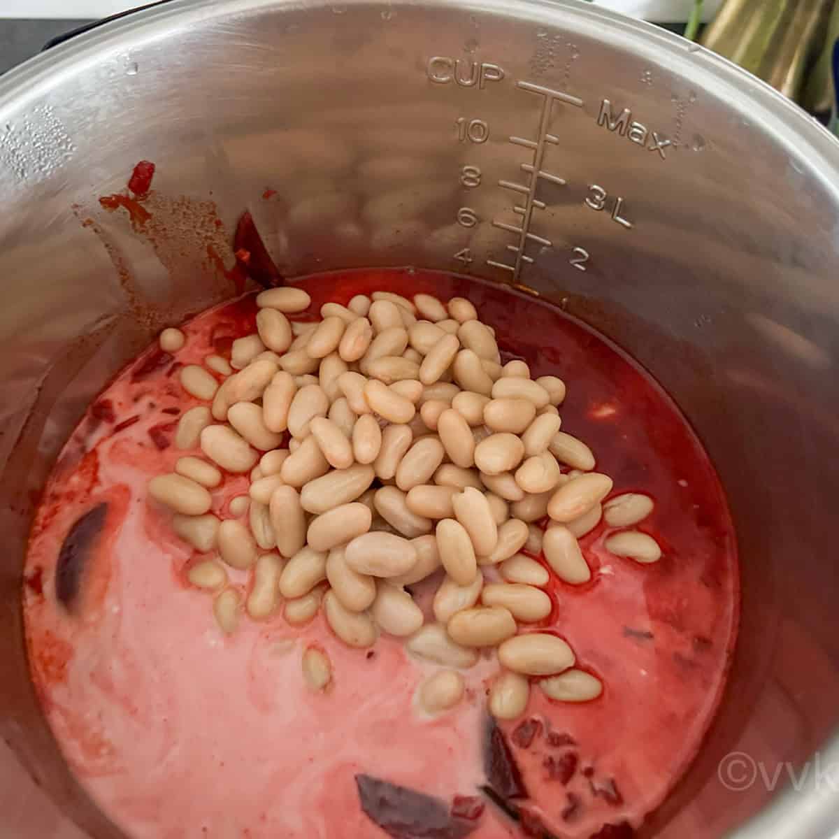 adding beans and coconut milk
