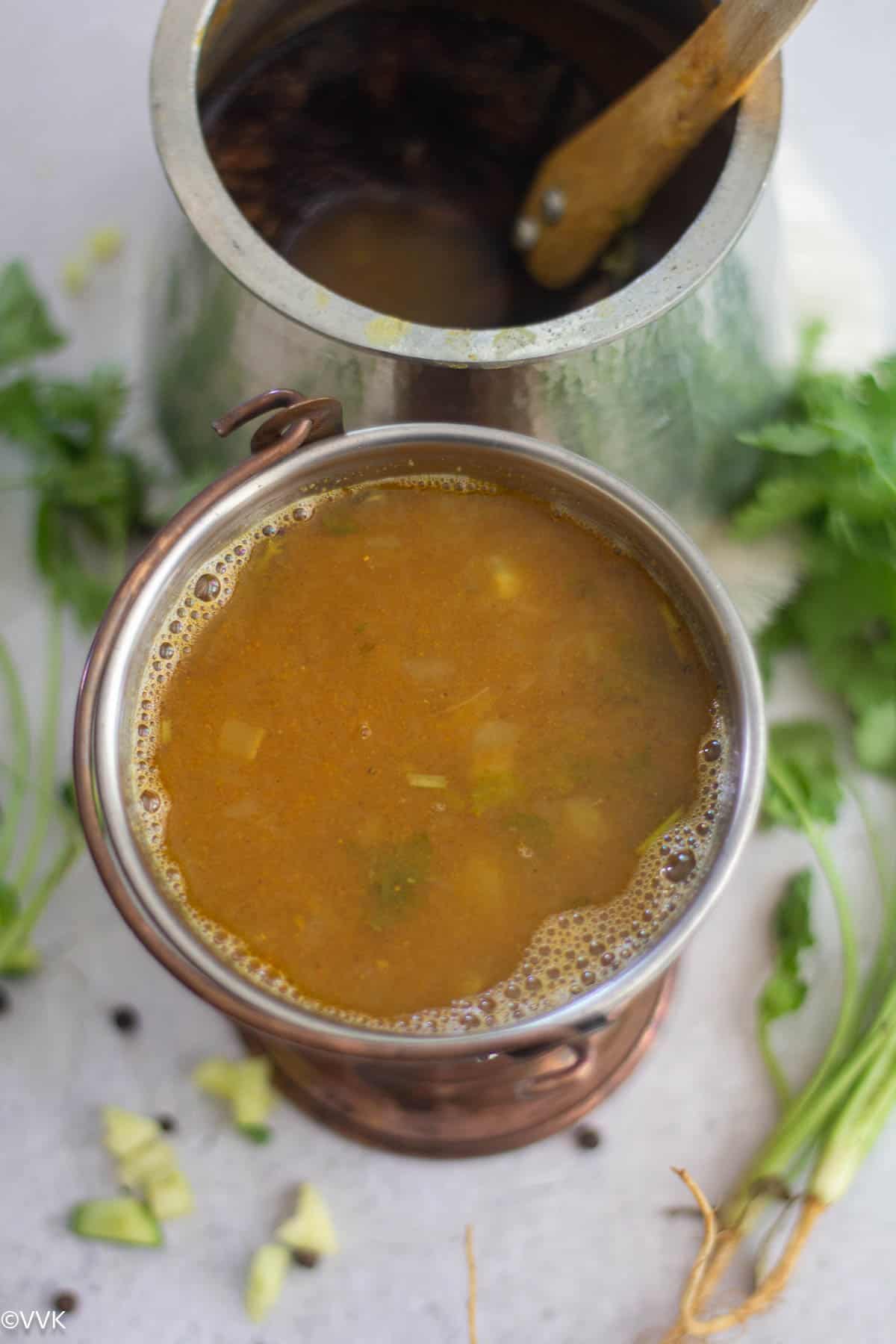 mango rasam served copperware bucket