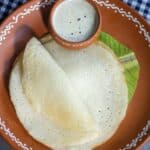 square image of watermelon rind dosa placed on banana leaf