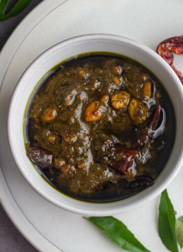 square image of curry leaves tamarind rice paste