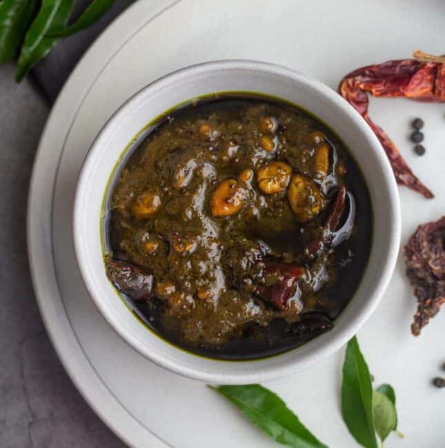 square image of curry leaves tamarind rice paste