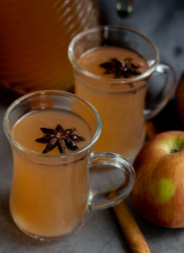 square image of apple cider served in two glasses