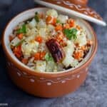 square image of carrot radish poriyal served in terracotta serveware