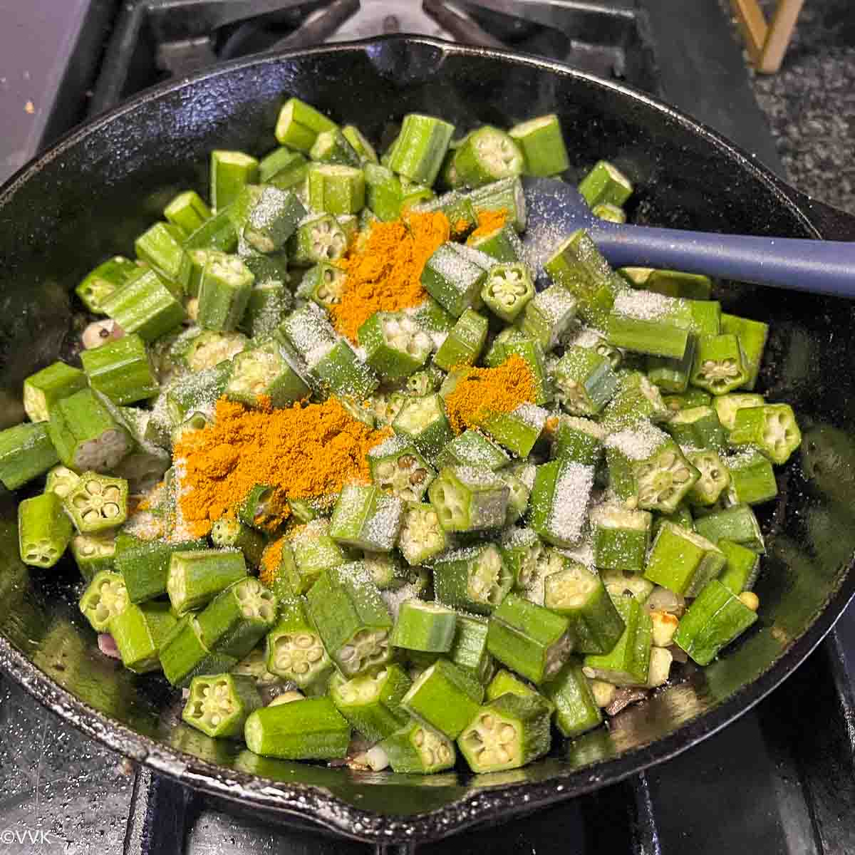 adding okra, spices and salt