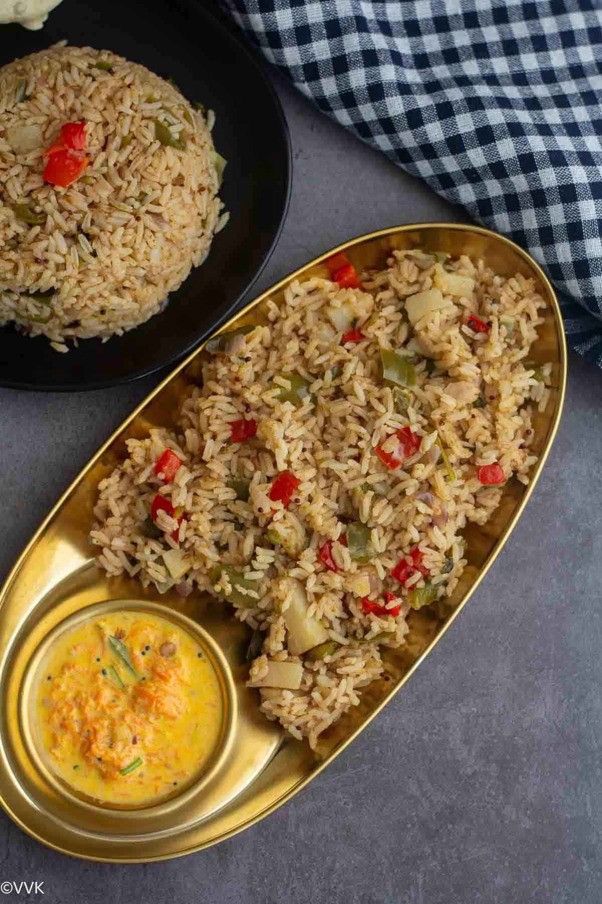 urulai kudaimilagai sadam with carrot onion raita served in golden plate