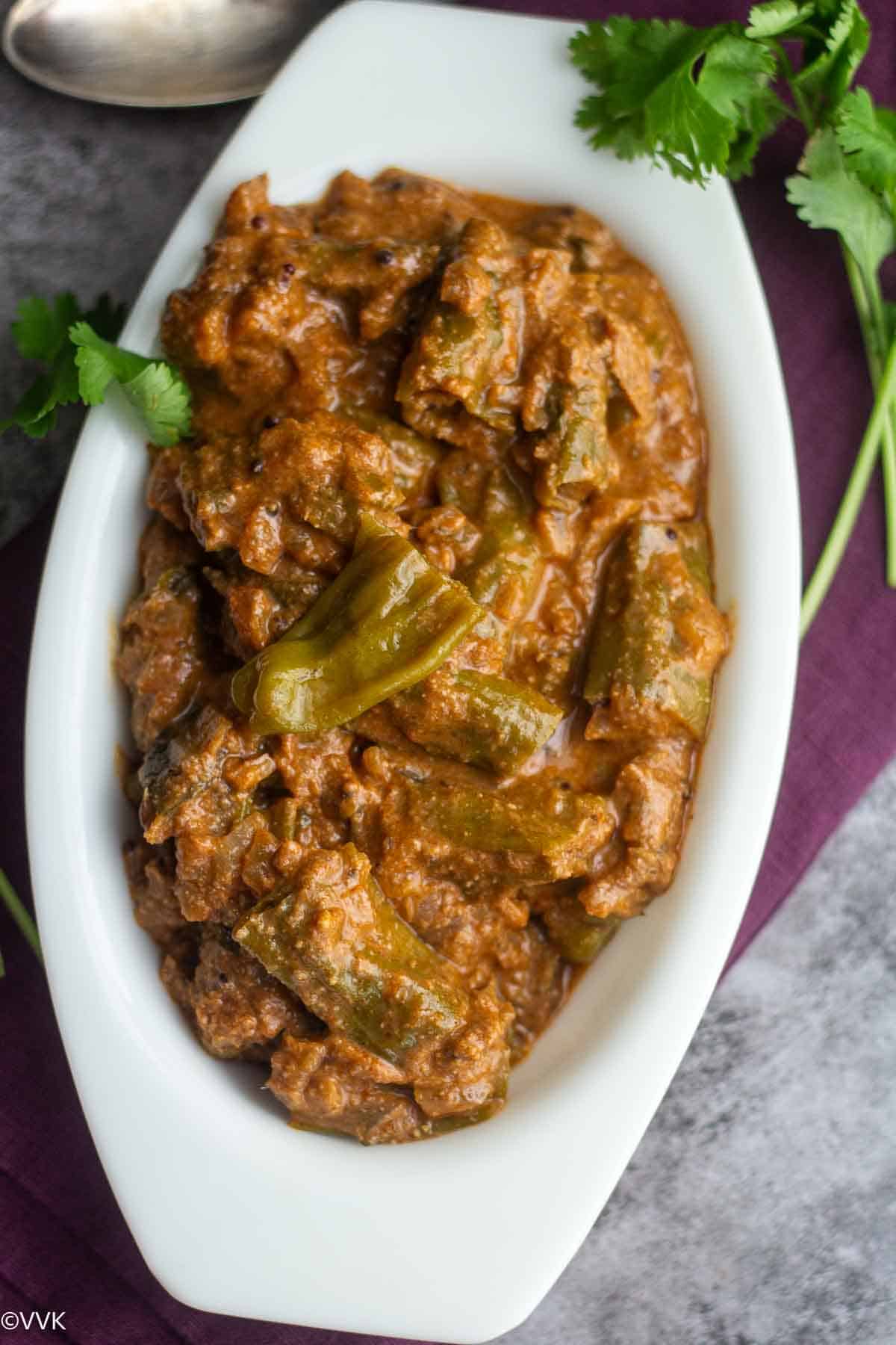 biryani salan with shishito peppers served in white bowl