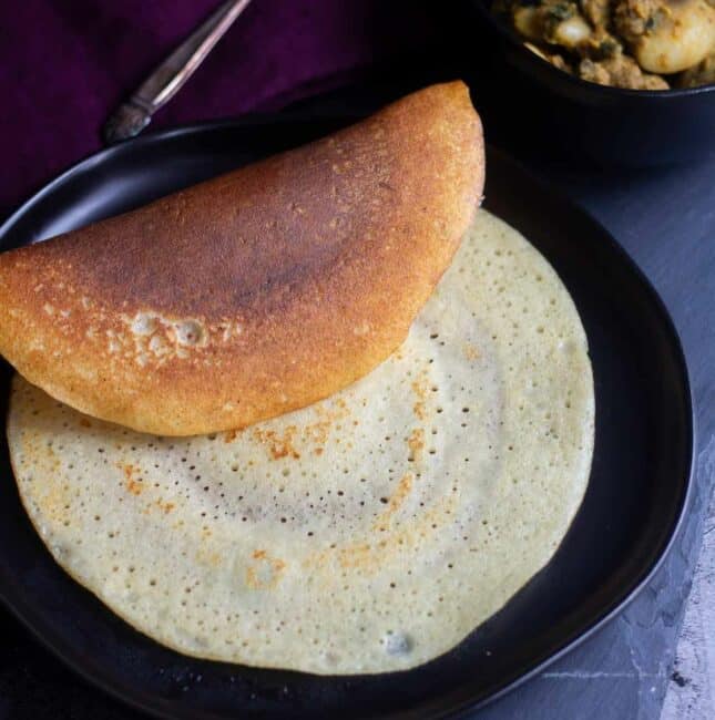 square image cottage cheese dosai served in black plate