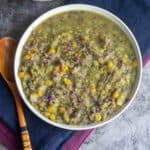 square image of cabbage kootu served in white bowl