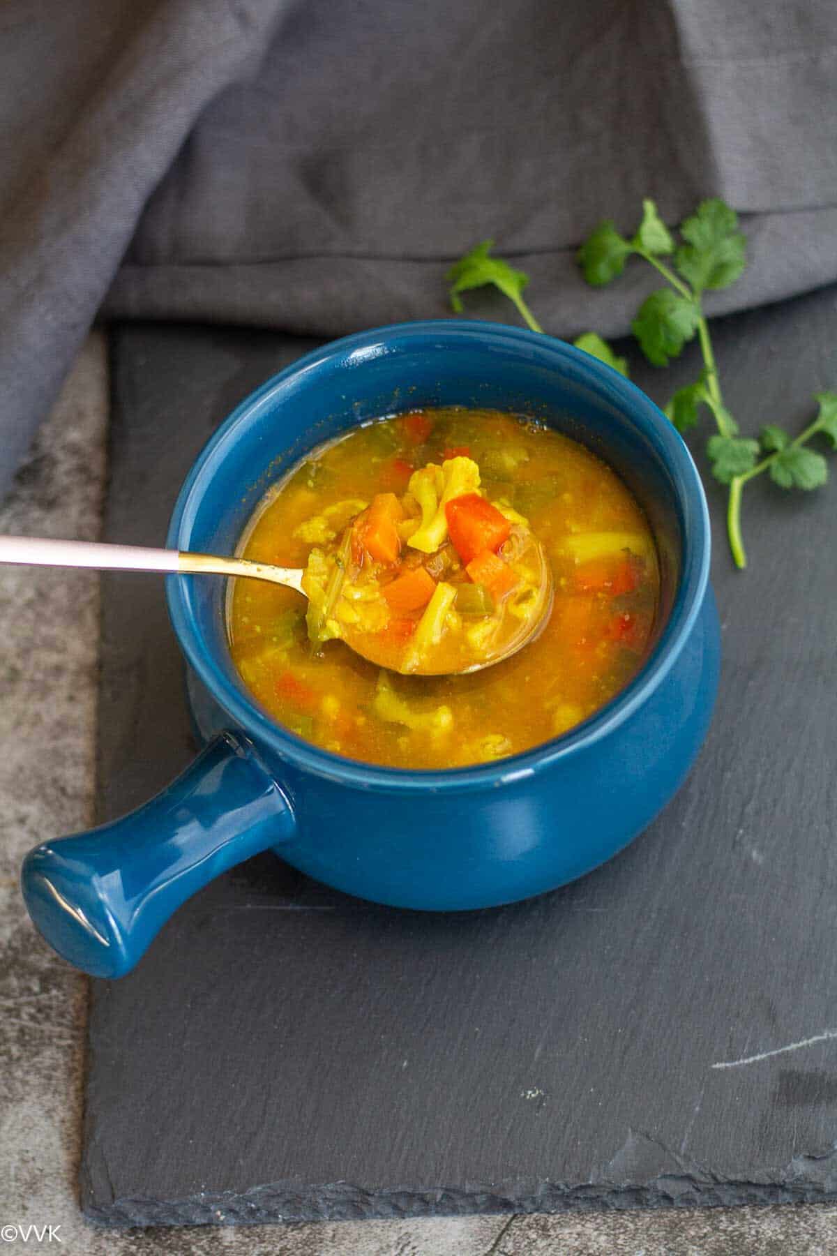 overhead shot of soup with spoon scooping the soup