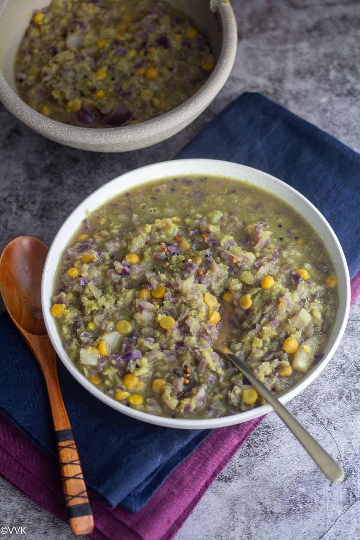 slanting shot of cabbage kootu served two bowls