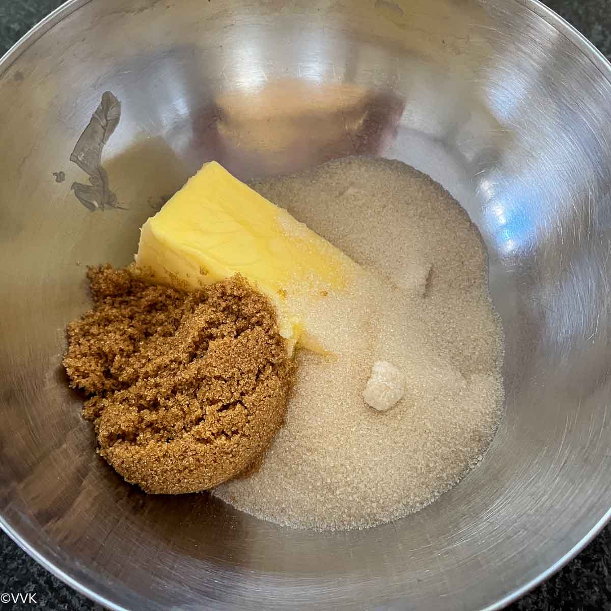 adding butter and sugar