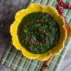 square image of spinach masiyal, a close up shot with tempering on top